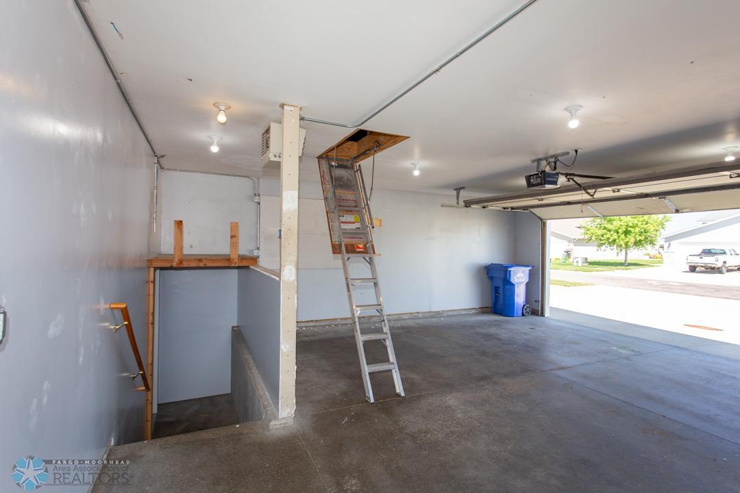 Ladder to upstairs storage area in Garage
