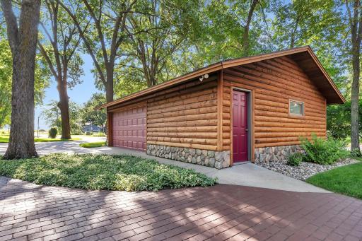 Detached Garage. Behind the garage: stacked wood for fireplace included
