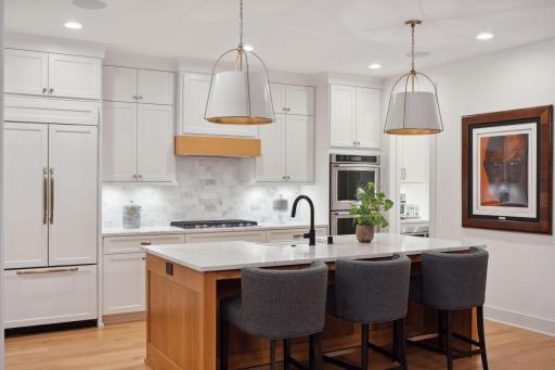 Quartz counters and marble subway tile back splash.
