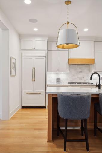 Custom wood paneled refrigerator and dishwasher.