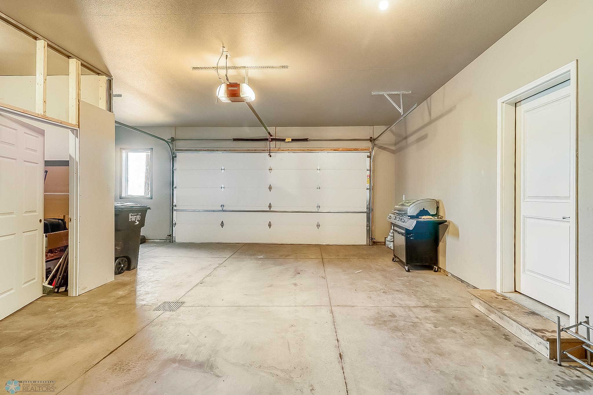 Garage- Storage area on left can be removed by seller if requested by buyer prior to closing.