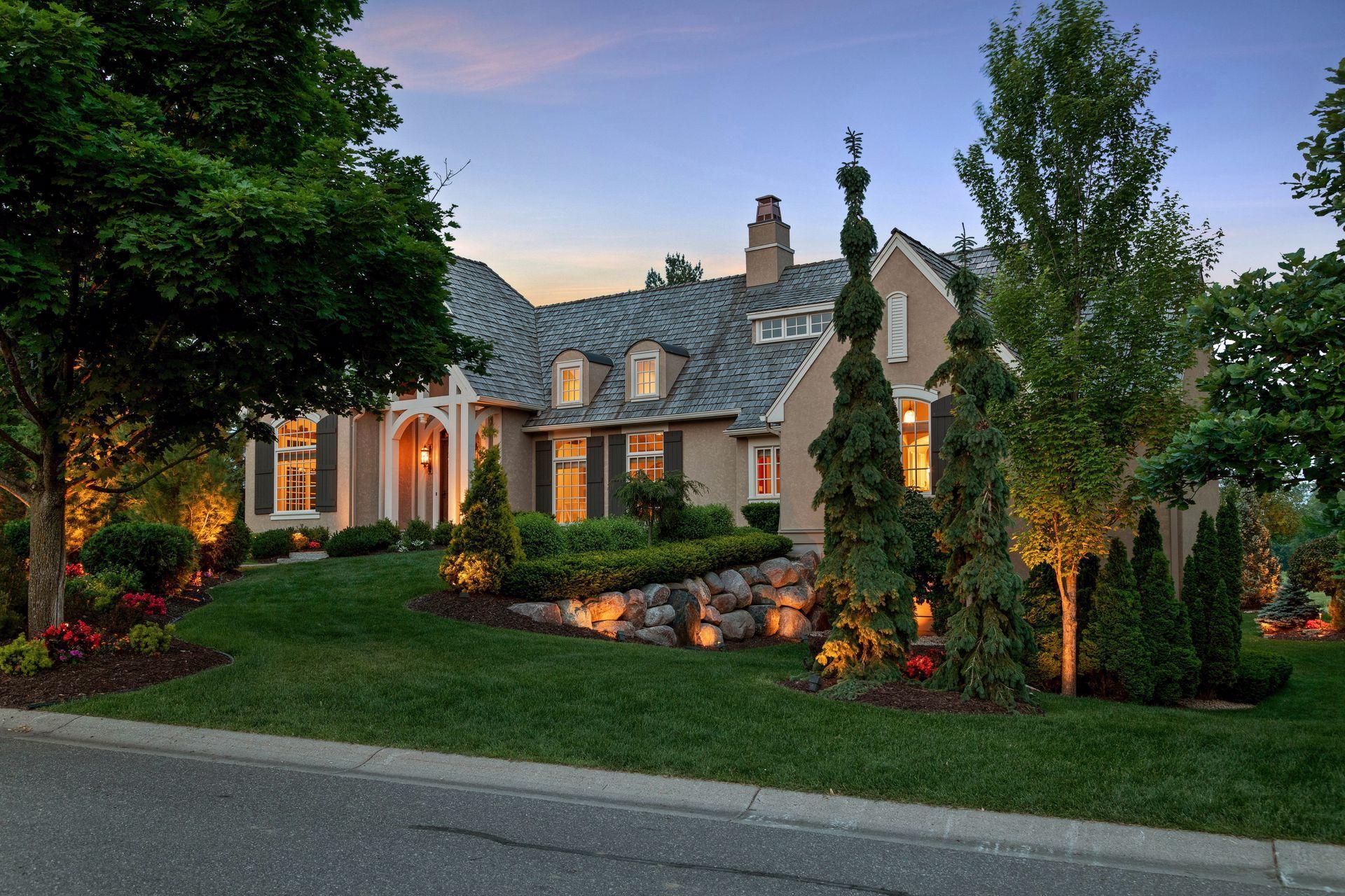 Extensive landscaping throughout this estate sets the curb appeal and tone for this exquisite home