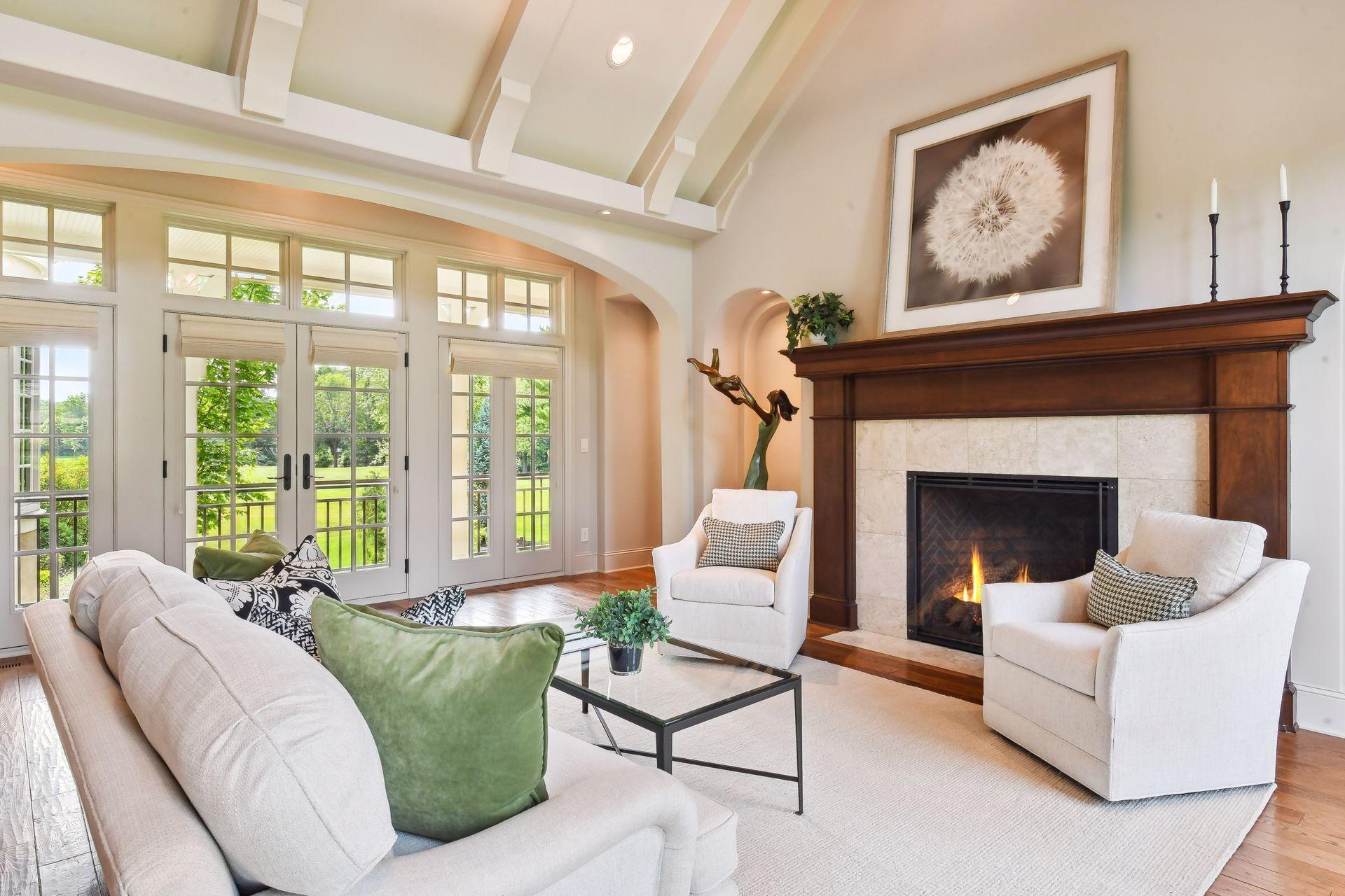 A grand yet cozy gas burning fireplace anchors one end of the living room