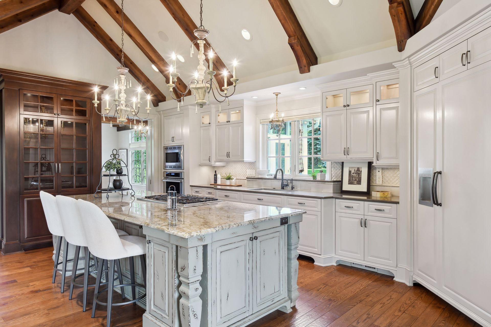 High-end Thermador appliances, granite tops, and plenty of cabinet storage throughout the kitchen