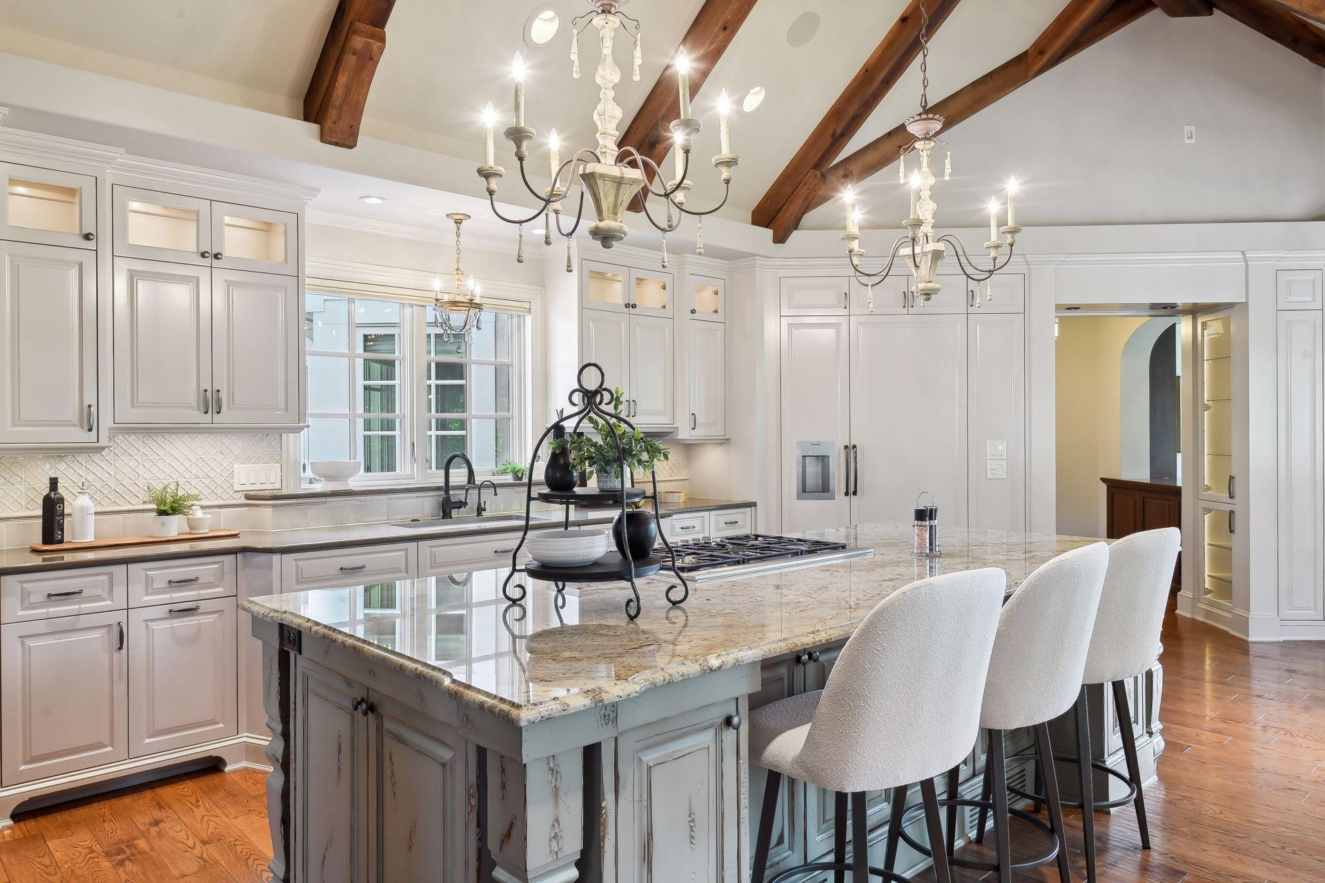 A large center island anchors the kitchen, ideal for meal prep or grabbing a quick bite to eat