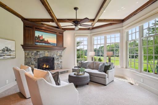 The main level sitting room is conveniently located off the kitchen
