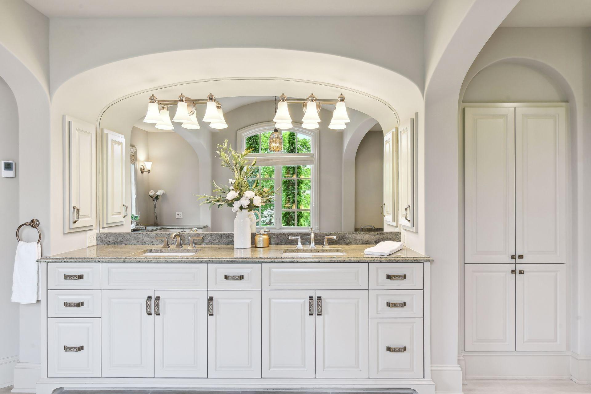 Thoughtfully planned with plenty of cabinets and storage space for bathroom essentials and linens