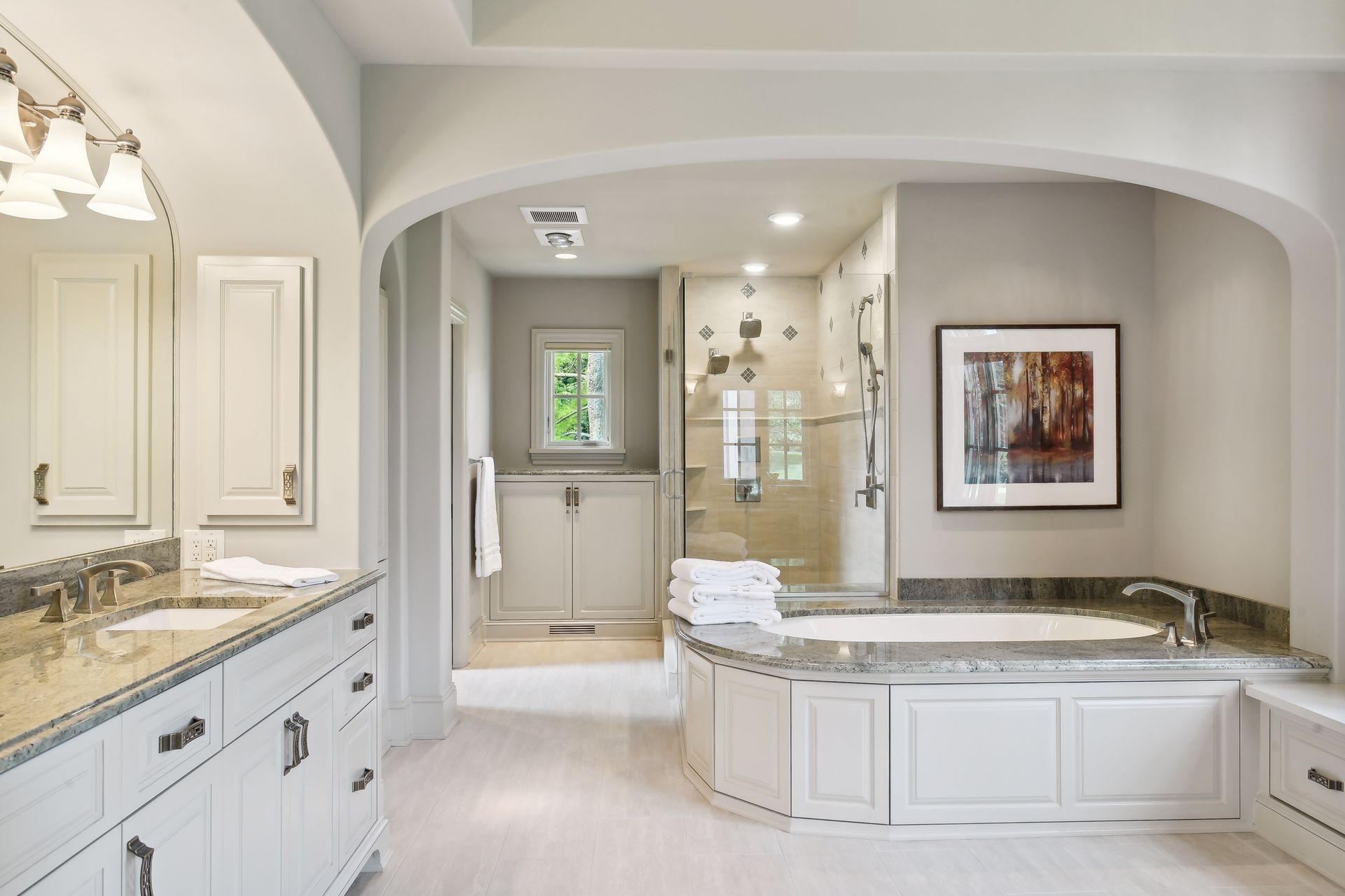 Heated floors, dual vanity areas, large soaker tub, and walk-in shower are just a few exquisite details in the owner's bath
