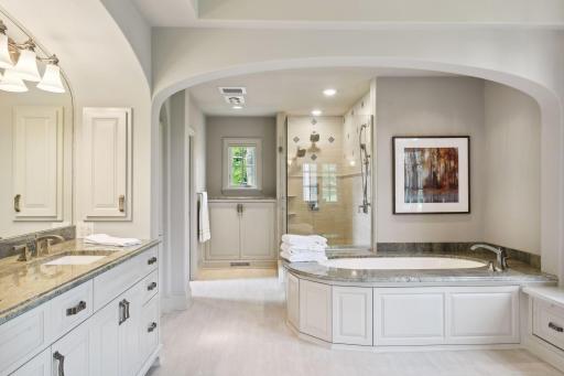 Heated floors, dual vanity areas, large soaker tub, and walk-in shower are just a few exquisite details in the owner's bath