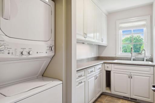 This laundry is located in the back hall, with additional laundry units found in the owner's suite and lower level