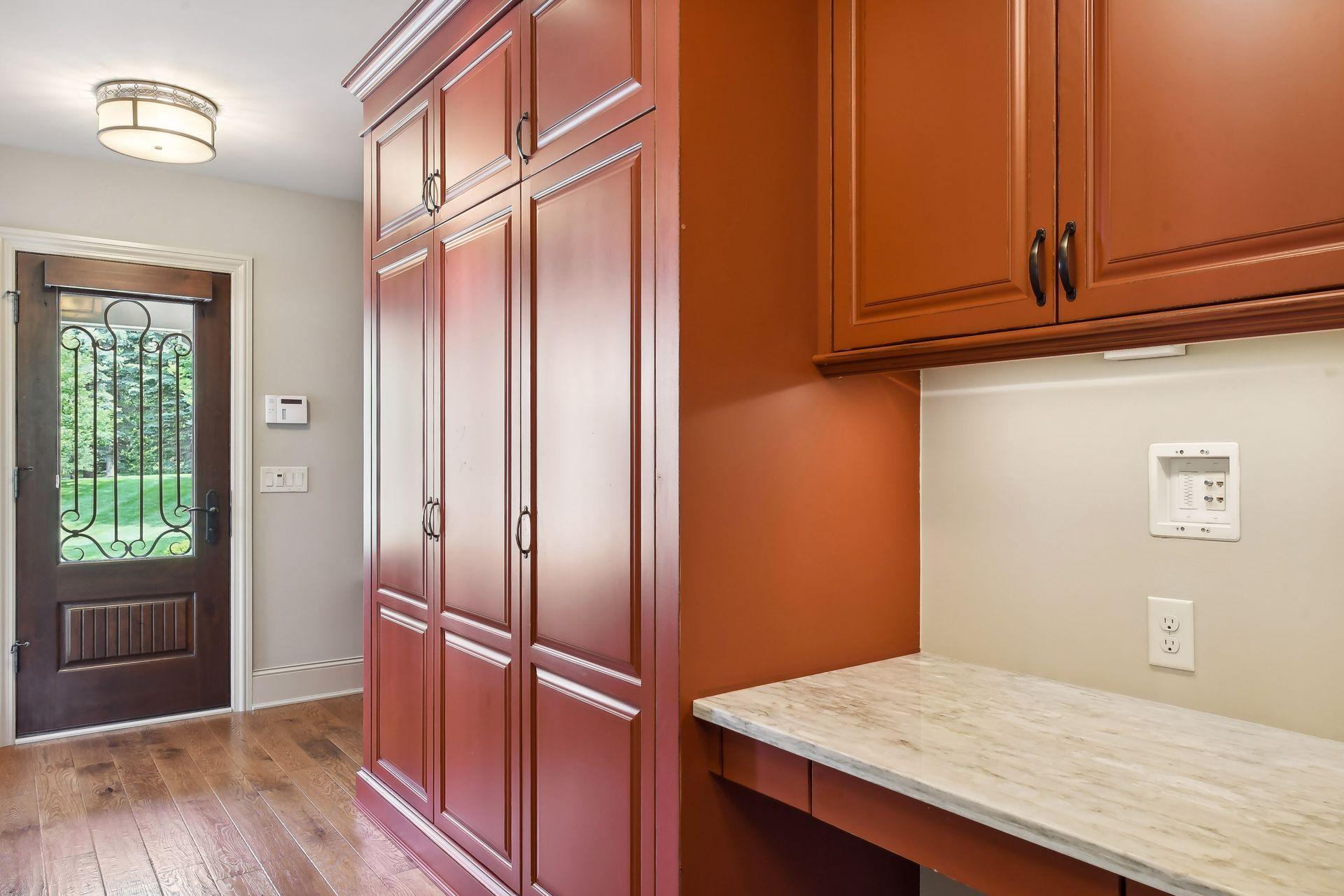 Pretty back hall door leads into the mud room