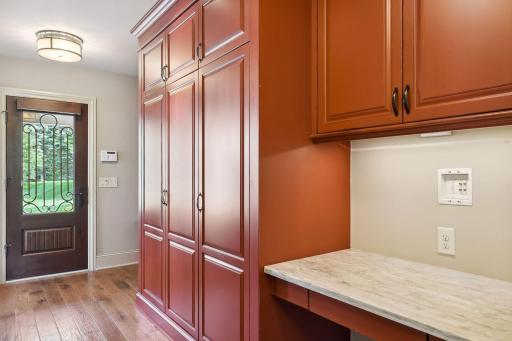 Pretty back hall door leads into the mud room