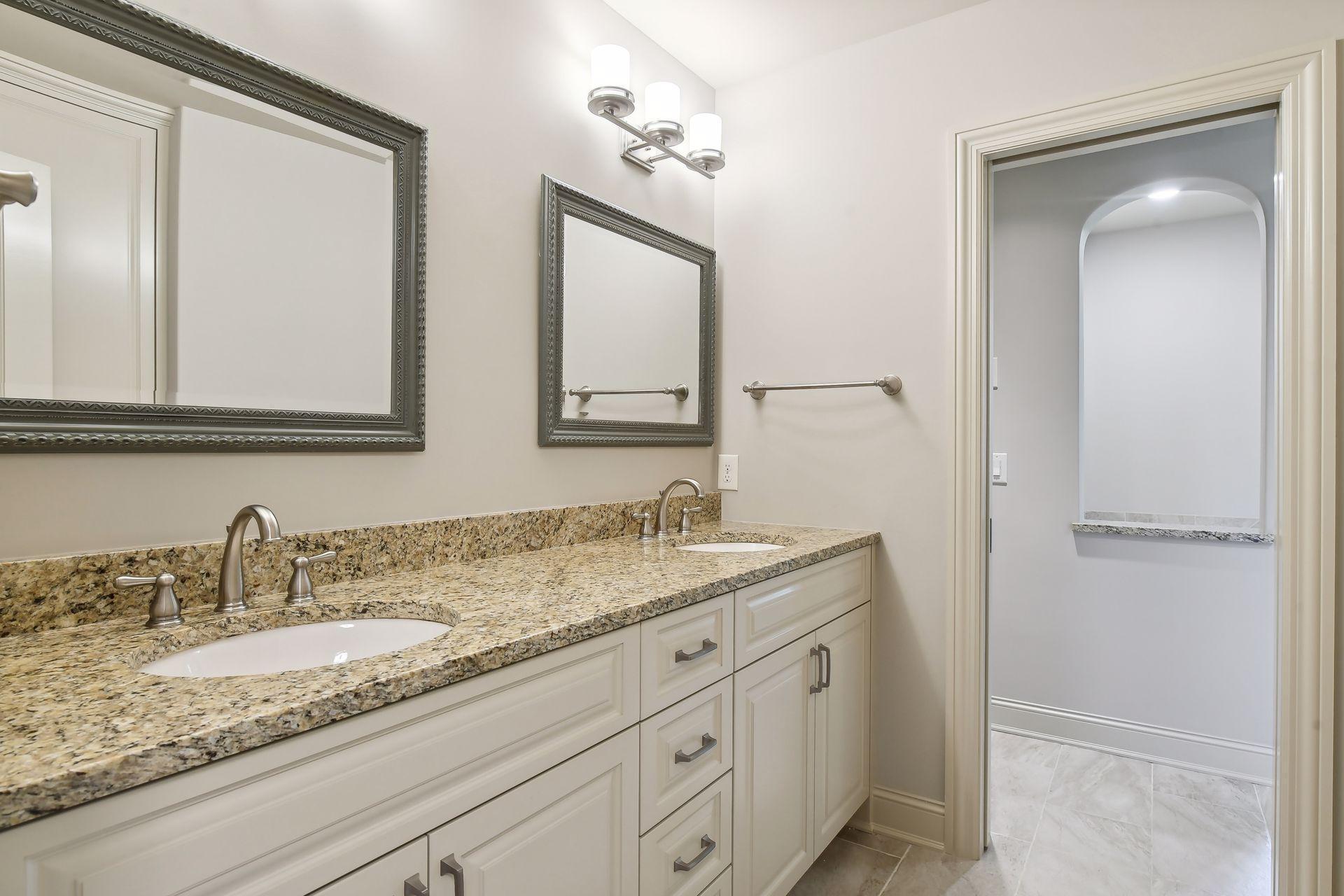 BRs #3 and #4 share this full bath with dual sinks, shower and tub