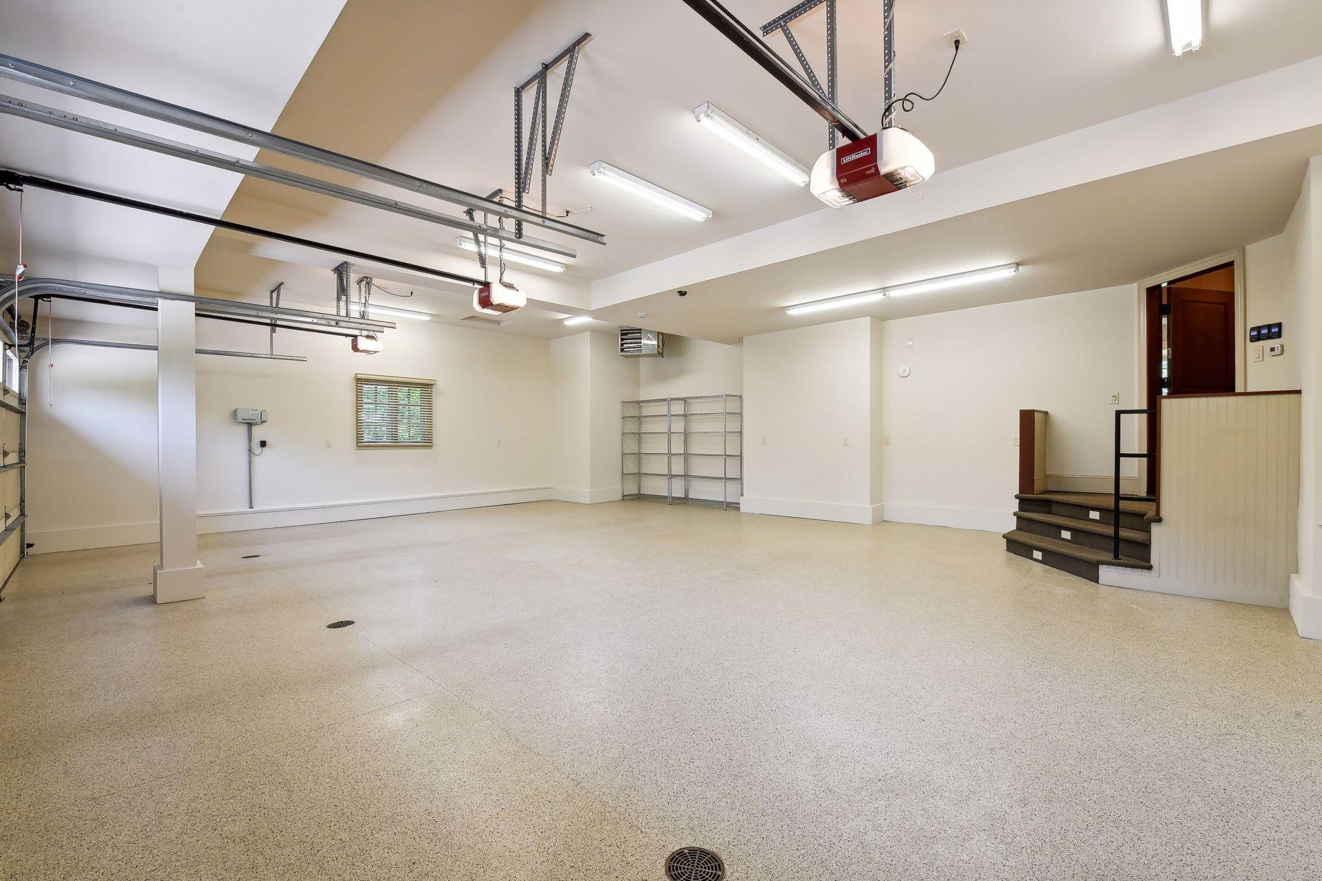 Oversized 3-car garage (heated) measures at 850 SQFT offering ample room for cars, golf cart, and storage