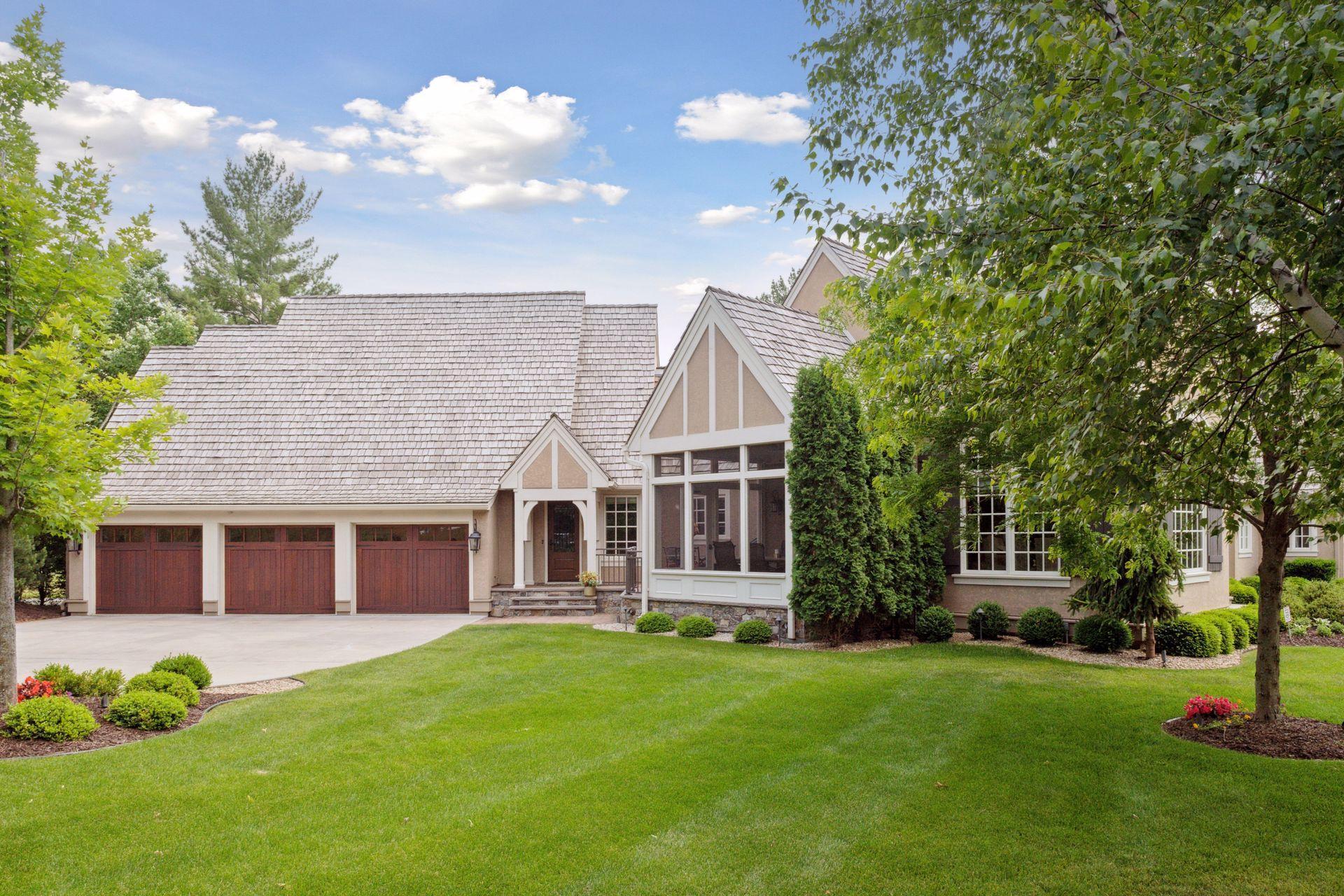 Daytime view of the private side yard, back hall entrance and screen porch