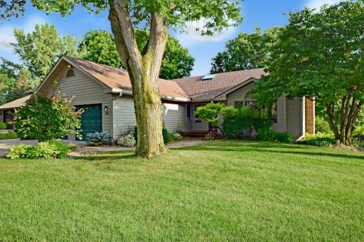 Welcome home to this spacious and sun drenched walkout rambler with commanding Southerly views of Spring Creek and Parmeadow park!