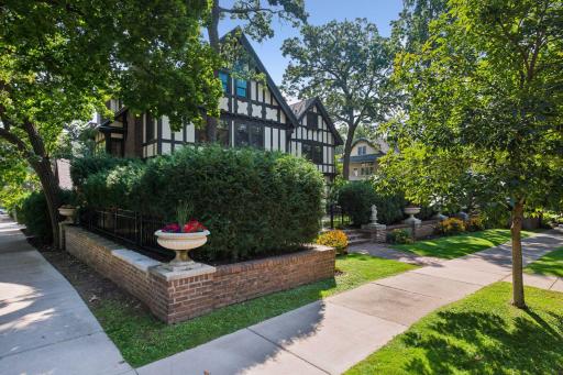 Stately street presence on a corner lot with a private wrap around yard.
