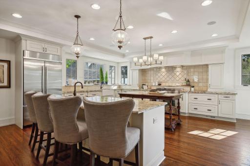 Spacious updated kitchen provides seating for informal gatherings and an extra dining area. Wonderful storage and counter space. Views to the garden and abundant morning light with eastern exposure.