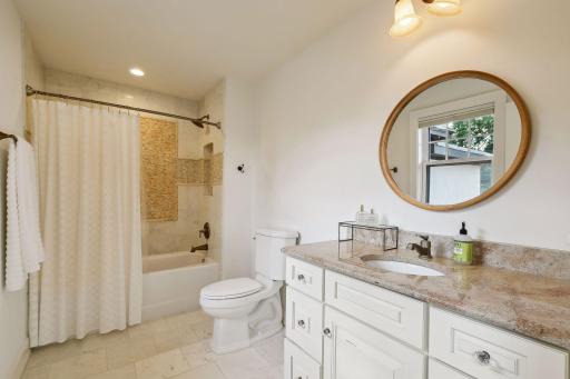 2nd bedroom en suite full bath with excellent storage and counter space.