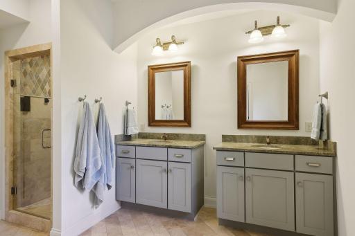 Hall 3/4 bath with double vanities and water closet is also en suite with 3rd bedroom.