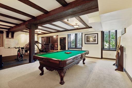 Lower level with billiard area, fitness, and an old world pub room.