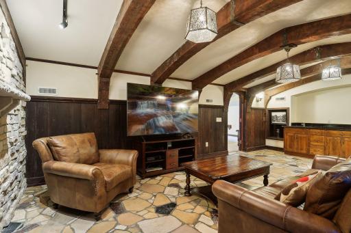 Lower level pub room/media room with wet bar and beverage cooler.
