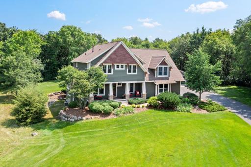 Nestled in the rolling hills of Inver Grove Heights, at the end of a cul-de-sac on a sprawling 2.7-acre lot, this stunning home offers unparalleled luxury and tranquility.