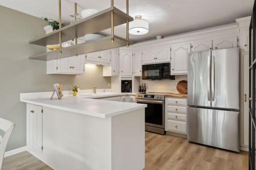 Corian tops in kitchen & new Oven and Refrigerator