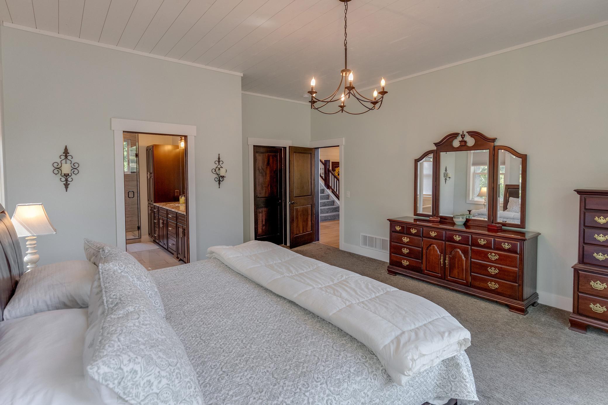 Main level primary bathroom with egress to the warp around deck