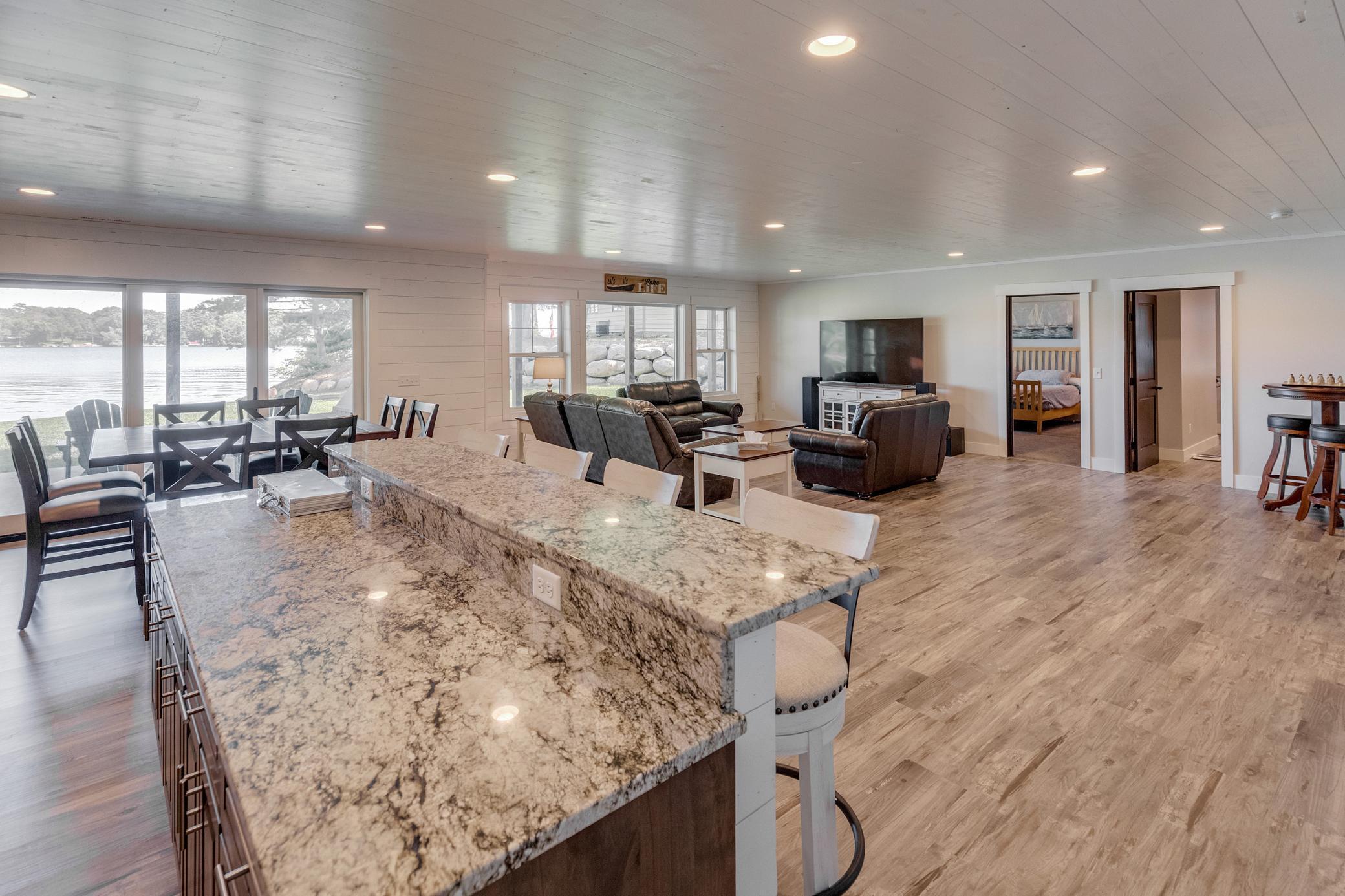 Lower Level wet bar overlooking the family room with a walkout to the patio