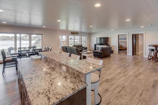 Lower Level wet bar overlooking the family room with a walkout to the patio