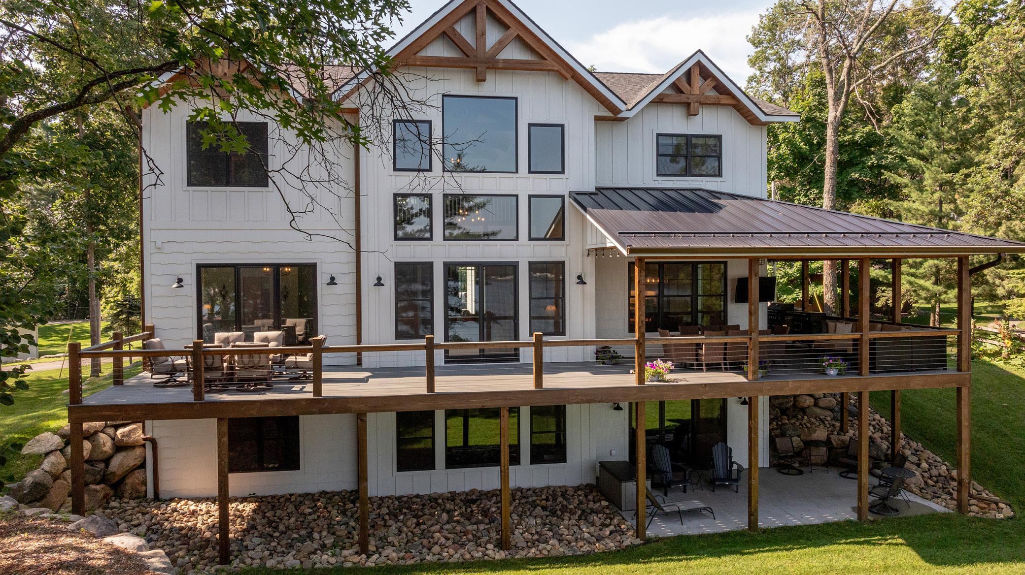 Waterfront Two Story with partially covered warp around deck.