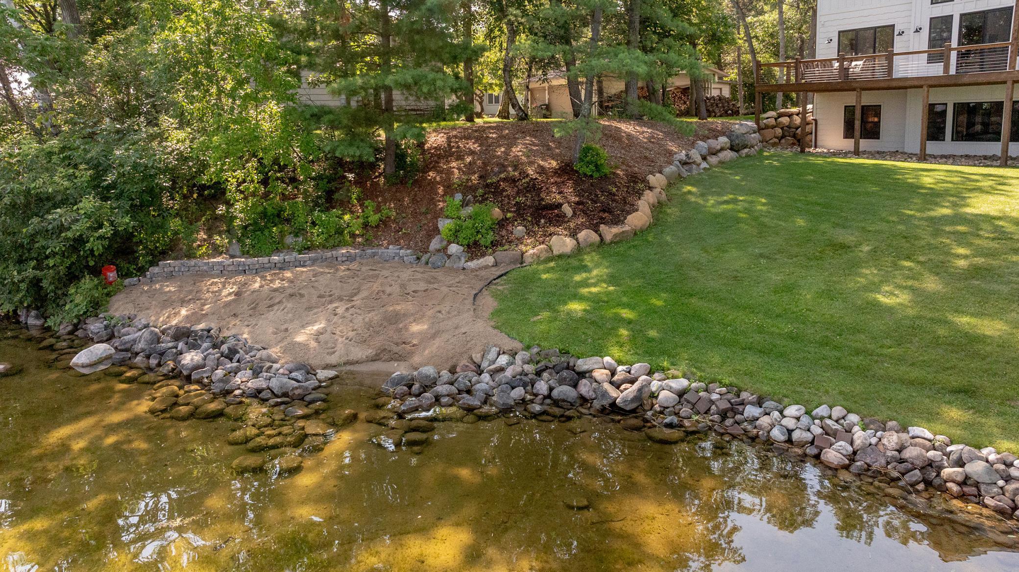 Finished landscaping with beach area.