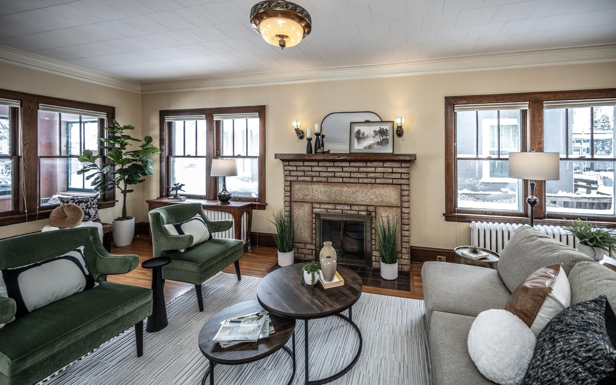 Hardwood floors, wall sconces, fireplace, historic windows