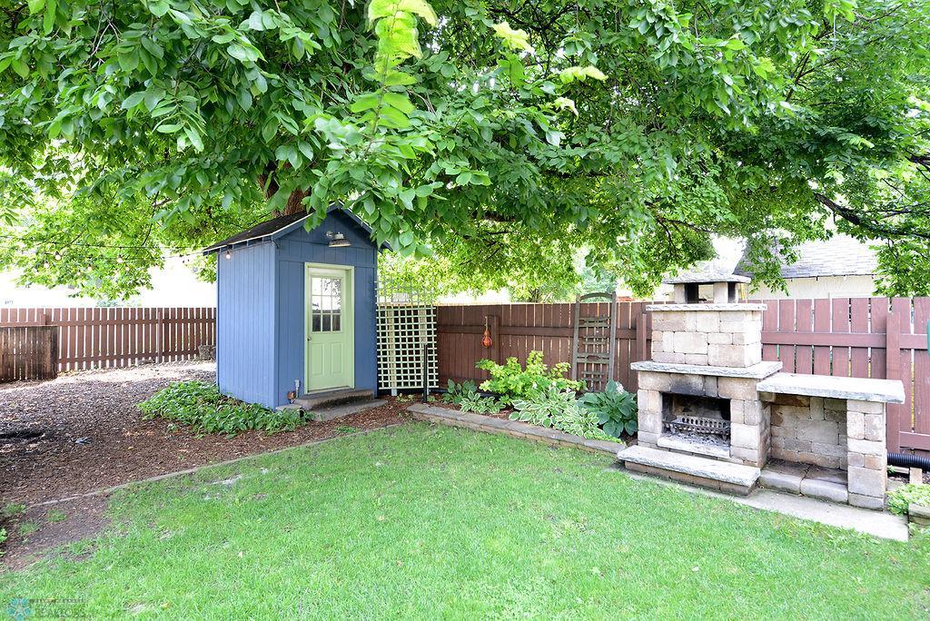 Backyard shed and fireplace