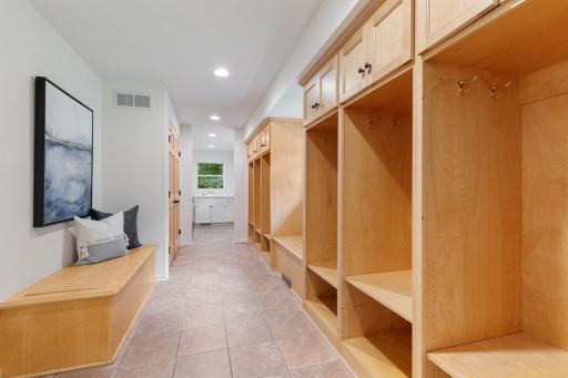 Spacious Mudroom leads into Main Floor Laundry