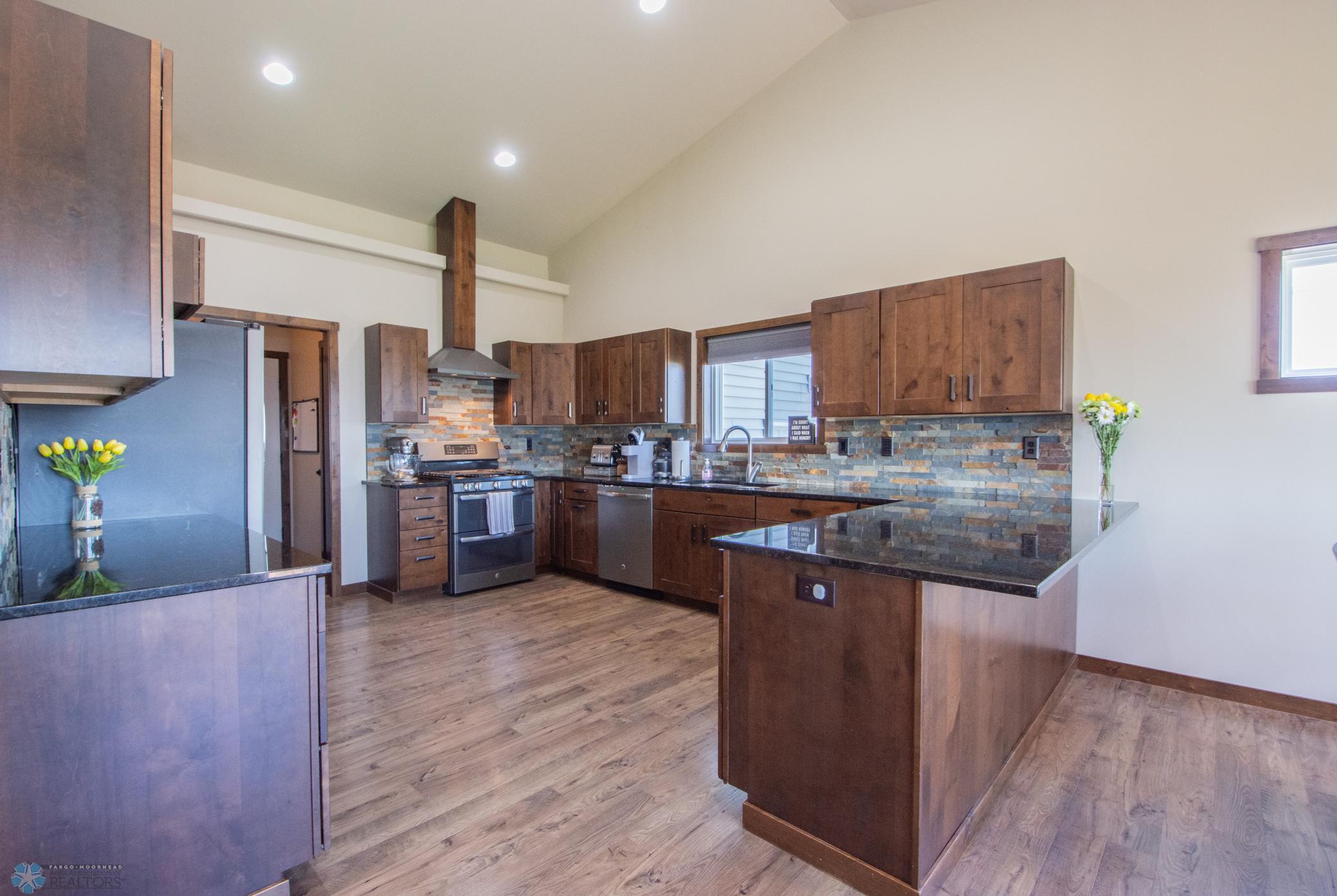 Beautiful kitchen with lots of cabinet/counter space; Granite surround
