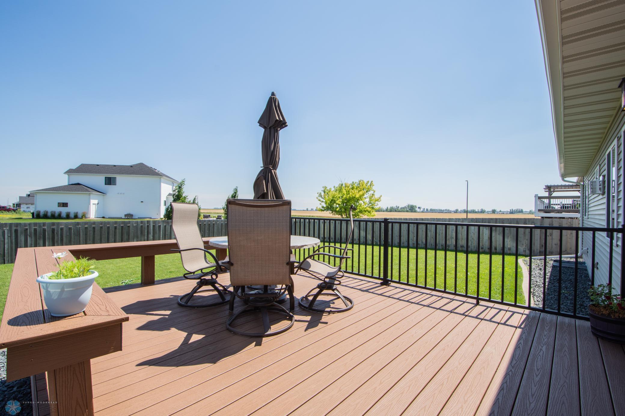Maintenance-Free Composite Decking with Wrought Iron and Built-In Bench
