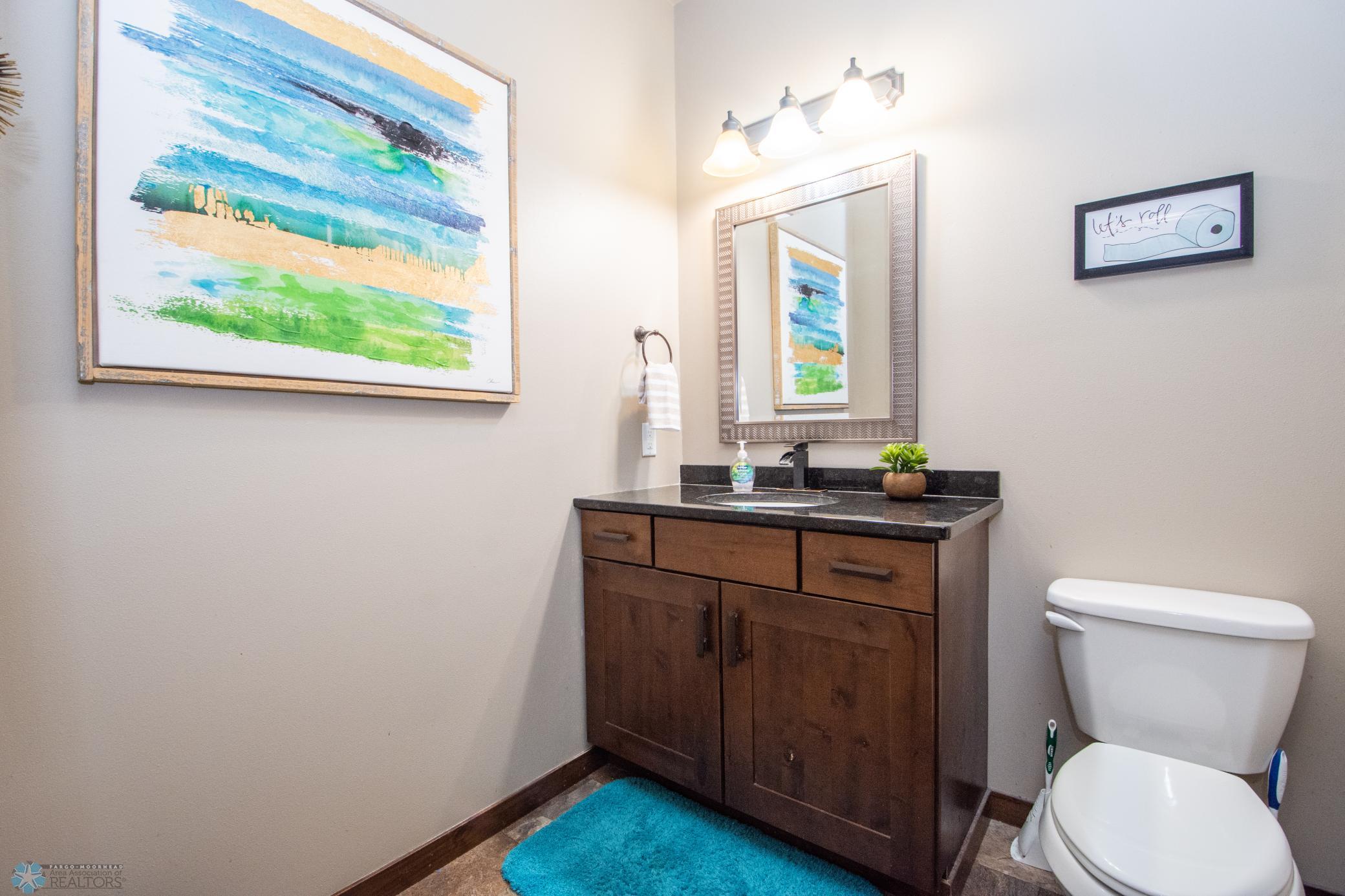 1/2 Bath on Main off of Garage Entry