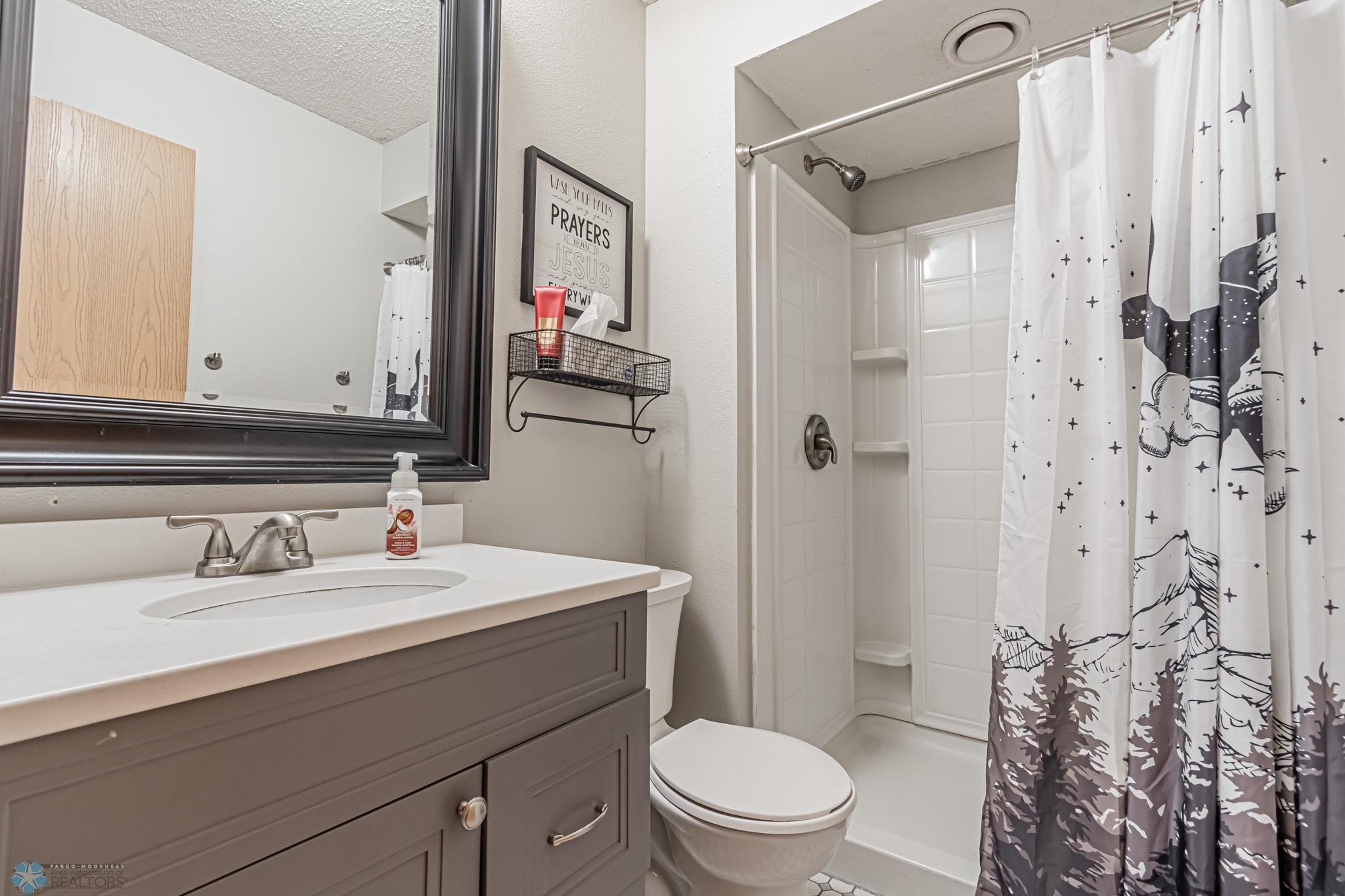 LowerLower 3/4 Bath - Added Quartz Countertop & Tiled Flooring