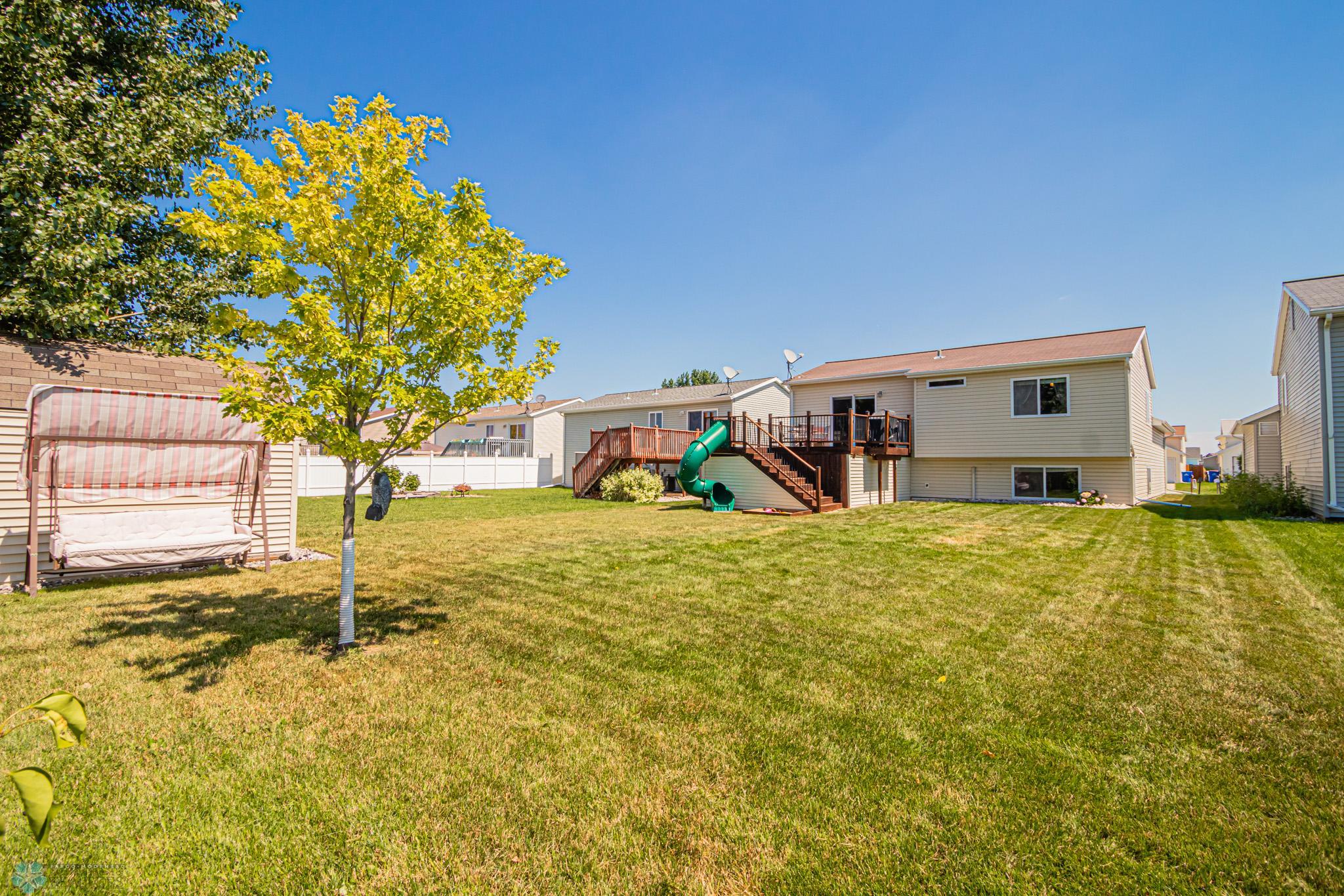 Nice Size backyard & comes with "kid-size" slide off the Deck!