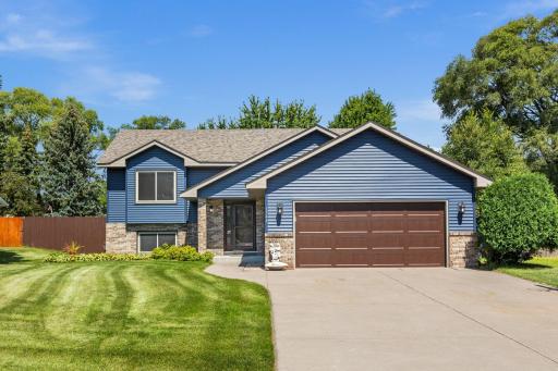 Located just 1 mile from DT Elk River, Step into this beautifully updated family home nestled in a serene cul-de-sac backing up to picturesque Lake Orono.