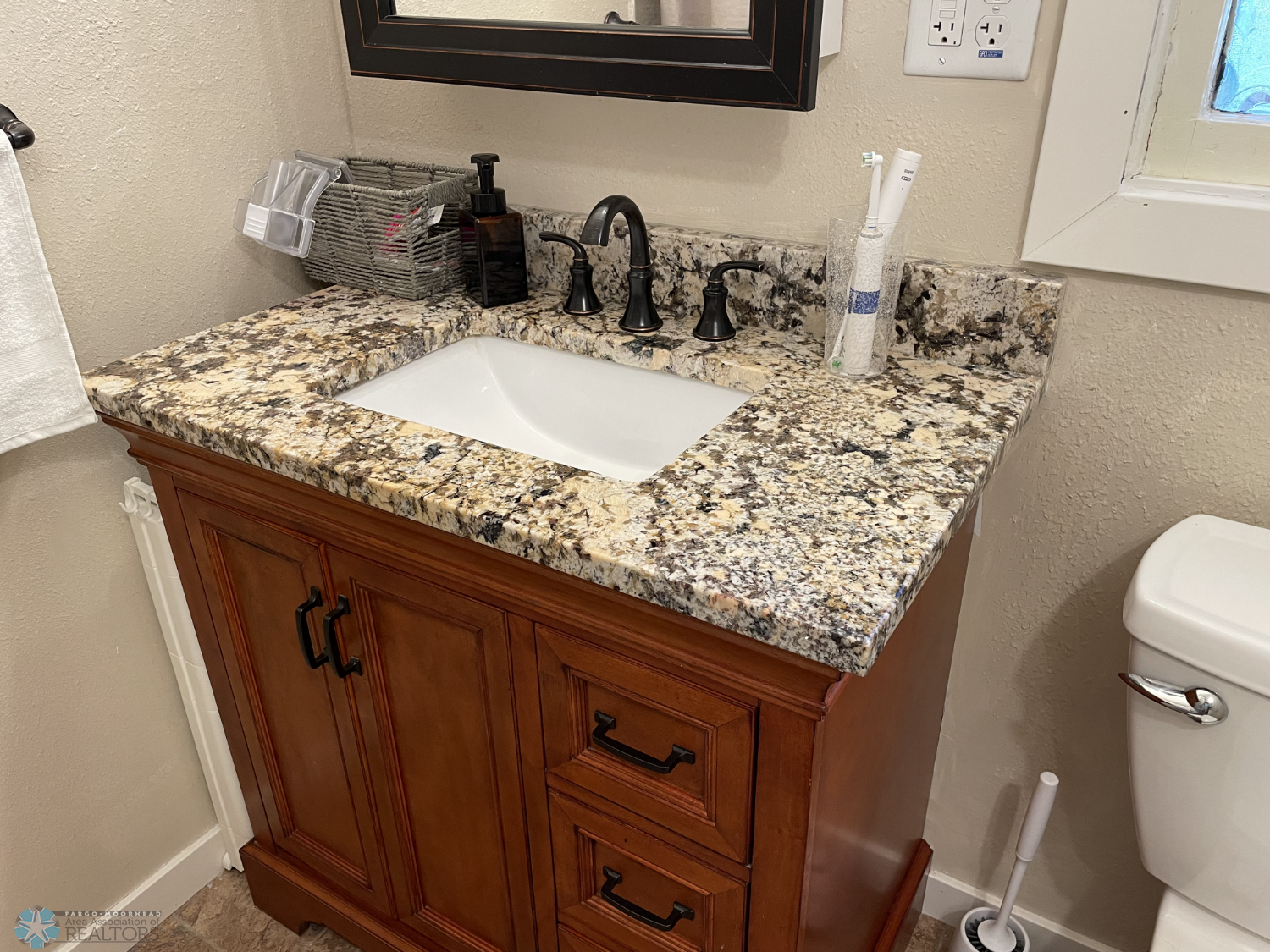 Main floor full bath updated vanity with granite counter.png