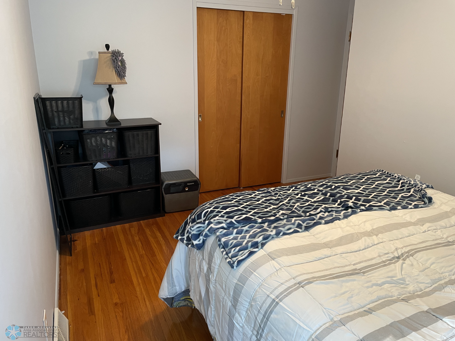 Bedroom 1 with solid oak floor - reverse view.png