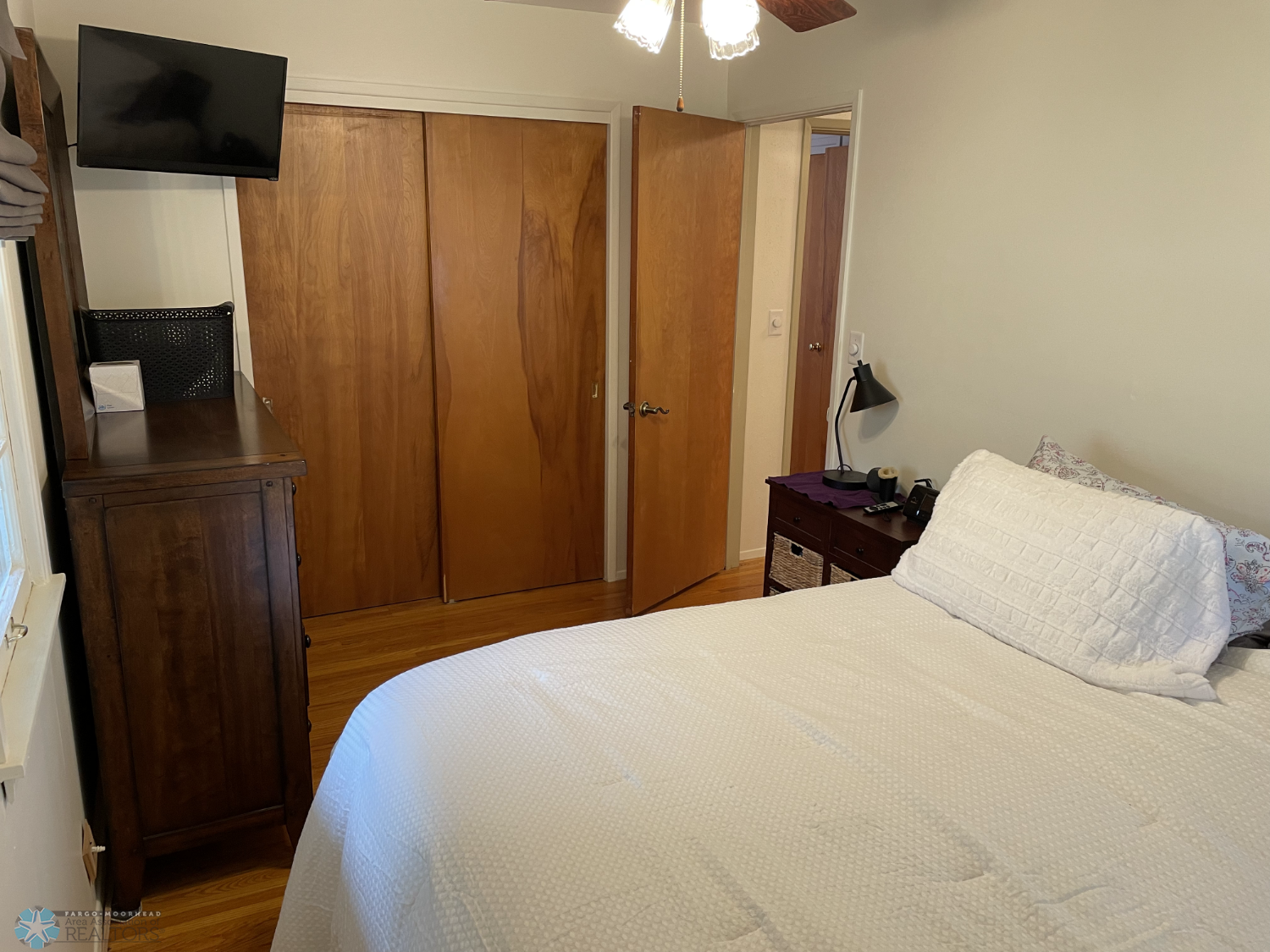 Bedroom 2 with solid oak floor - reverse view.png
