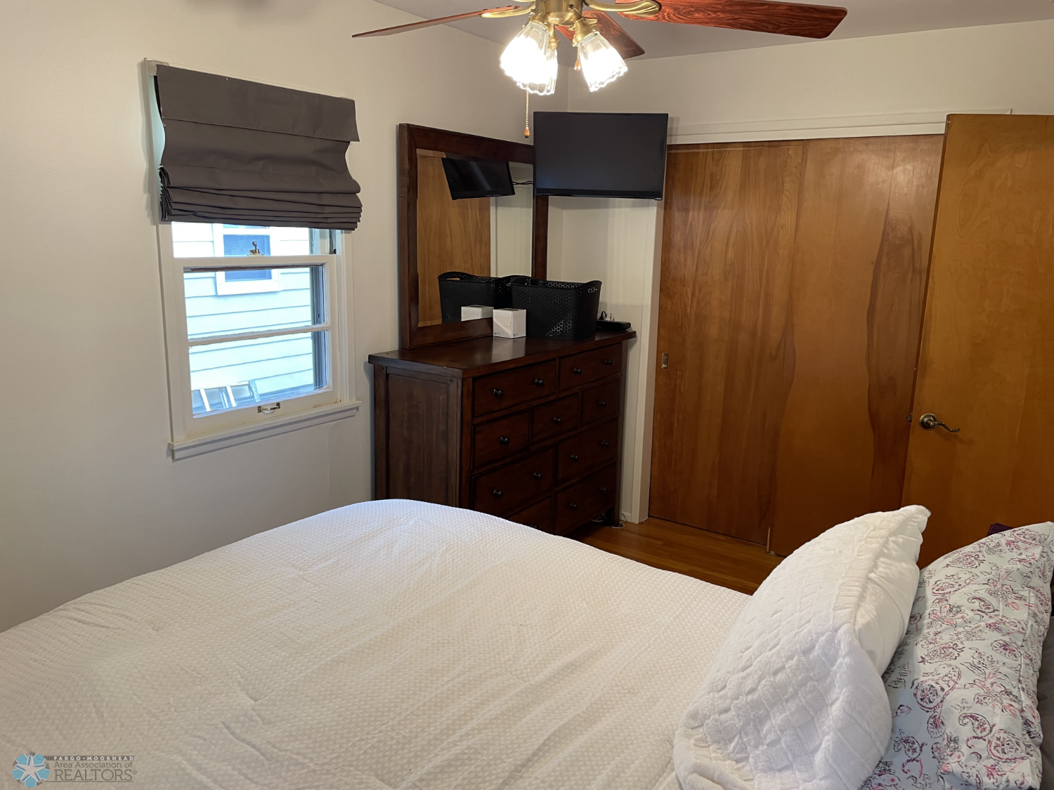 Bedroom 2 with solid oak floor - reverse view 2.png
