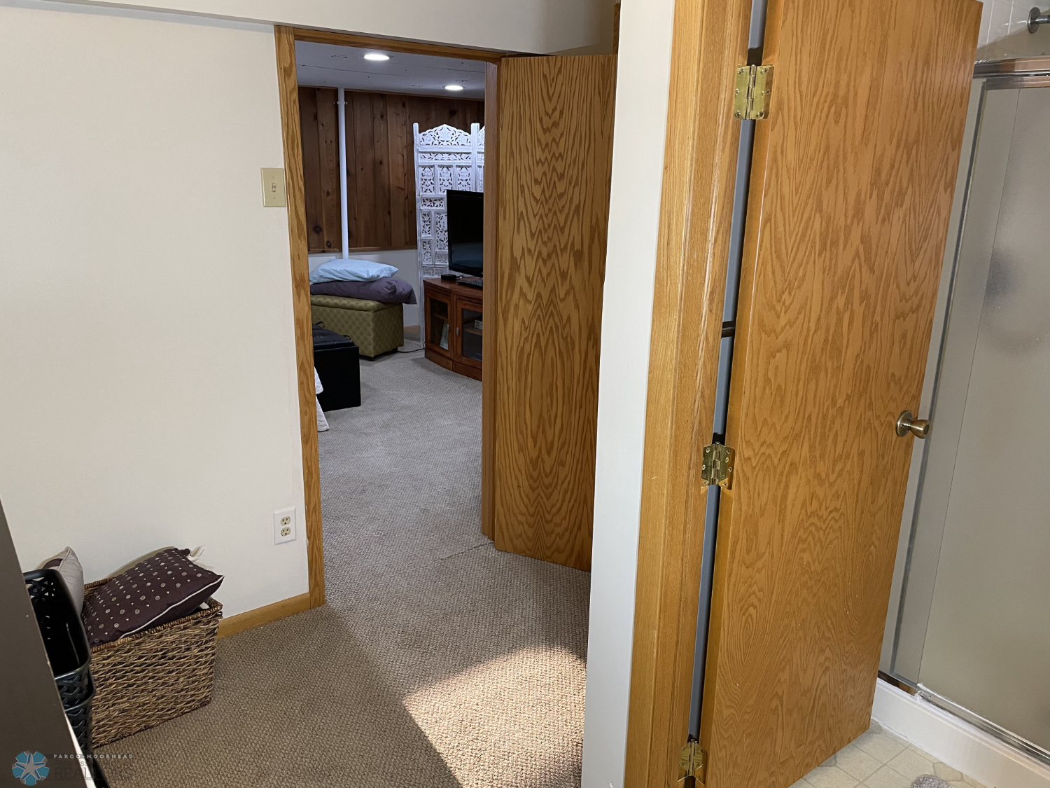 Finished area with cabinets & closet next to basement bathroom - view 1.png