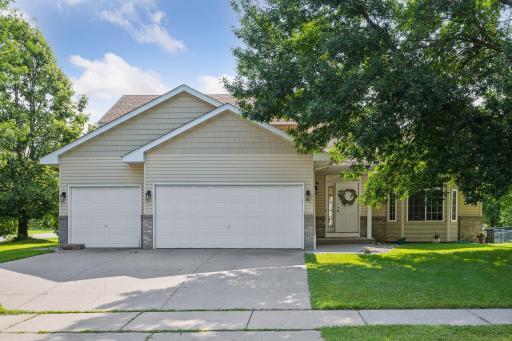Photo for 12240 Walnut Drive, Rogers, MN 55374 - listing #6580214 This one owner home speaks to the friendly neighborhood here. Note the 26' wide CEMENT driveway with a gentle slope. Good for chalk pictures! And parking lots of cars...the sidewalk is on this side of the street.