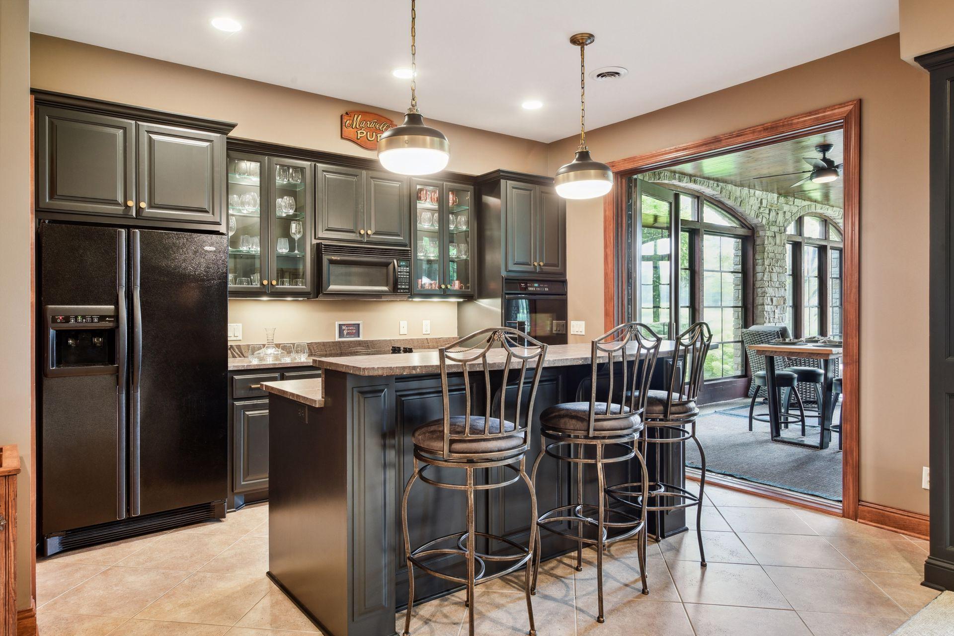 Stunning bar area walks out to beautiful screen in porch