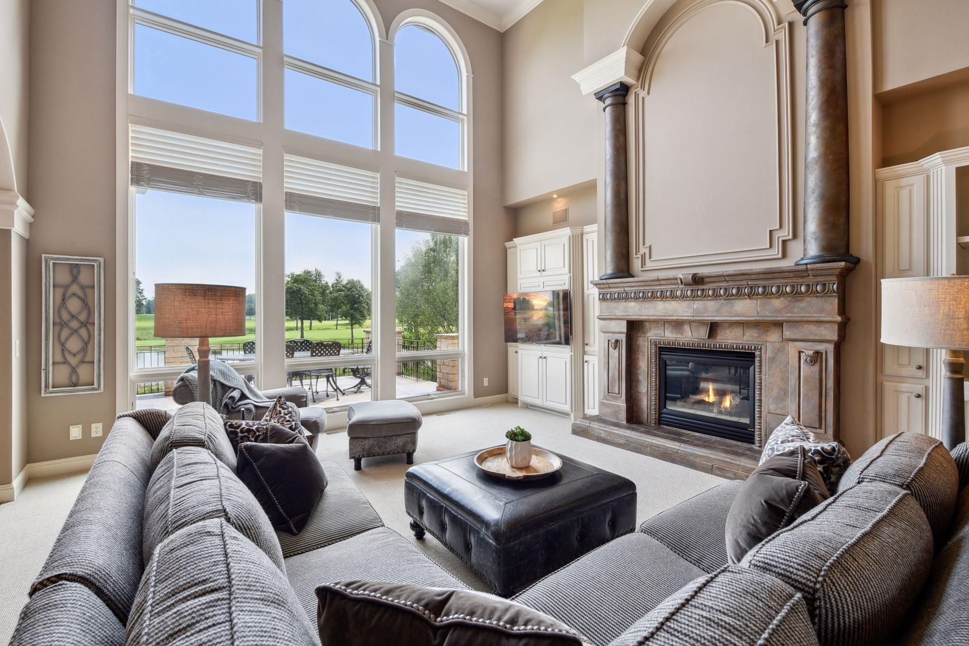 The great room offers more great vistas and includes one of 4 fireplaces in this home